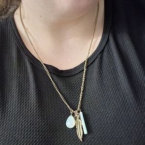 Charming Charlie pendant necklace with feather
